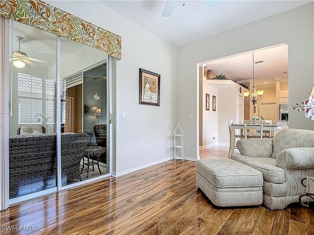 2050 Rio Nuevo Dr, North Fort Myers, FL 33917 - living area featuring ceiling fan, wood finished floors, and a chandelier