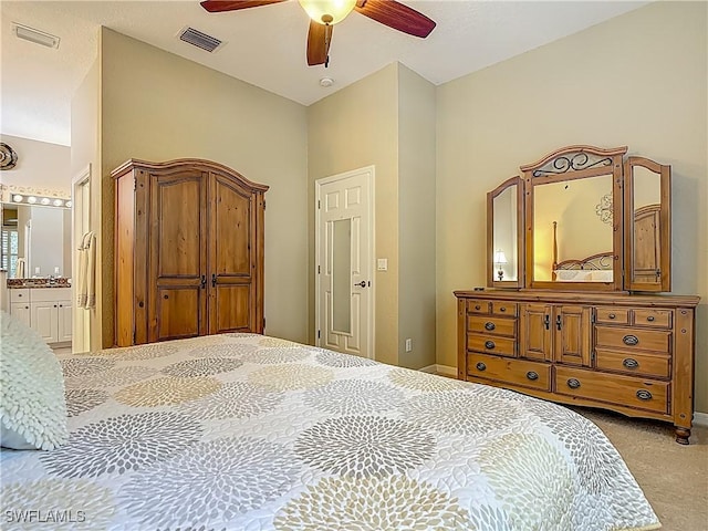 2050 Rio Nuevo Dr, North Fort Myers, FL 33917 - carpeted bedroom featuring connected bathroom and ceiling fan