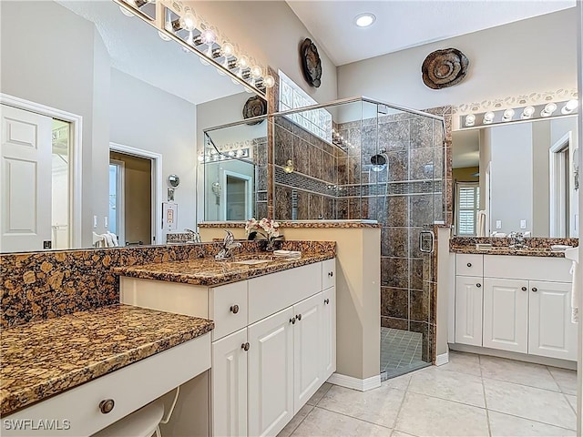 2050 Rio Nuevo Dr, North Fort Myers, FL 33917 - bathroom featuring a stall shower, two vanities, tile patterned floors, and recessed lighting