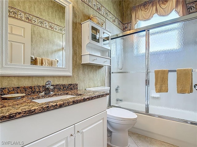 2050 Rio Nuevo Dr, North Fort Myers, FL 33917 - full bathroom featuring vanity, shower / bath combination with glass door, and tile patterned floors