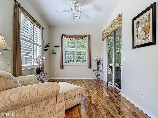 2050 Rio Nuevo Dr, North Fort Myers, FL 33917 - living room with wood finished floors, healthy amount of natural light, and ceiling fan