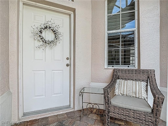 2050 Rio Nuevo Dr, North Fort Myers, FL 33917 - view of exterior entry featuring stucco siding