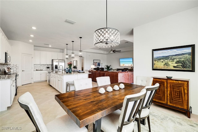 3470 Nombella Ct, Fort Myers, FL 33905 - dining room featuring recessed lighting, a chandelier, and a ceiling fan
