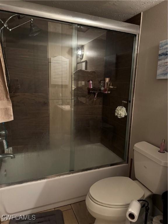 5307 Summerlin Rd Unit 704, Fort Myers, FL 33919 - full bath with enclosed tub / shower combo and a textured ceiling