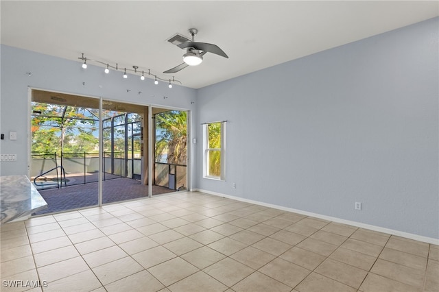 8169 Silver Birch Way, Lehigh Acres, FL 33971 - spare room with a ceiling fan, light tile patterned floors, and rail lighting