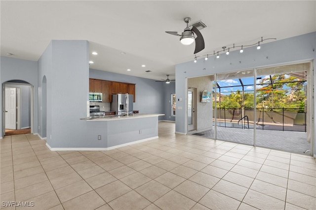 8169 Silver Birch Way, Lehigh Acres, FL 33971 - unfurnished living room with ceiling fan, arched walkways, light tile patterned flooring, and recessed lighting