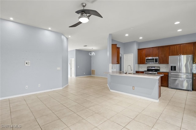 8169 Silver Birch Way, Lehigh Acres, FL 33971 - kitchen with stainless steel appliances, a ceiling fan, recessed lighting, light countertops, and open floor plan
