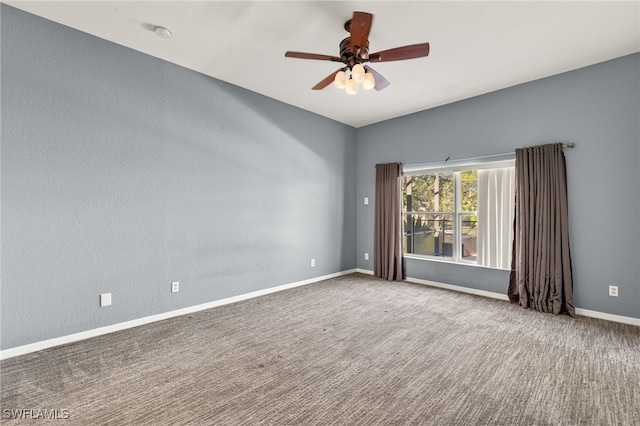 8169 Silver Birch Way, Lehigh Acres, FL 33971 - spare room with ceiling fan, carpet, and a smoke detector