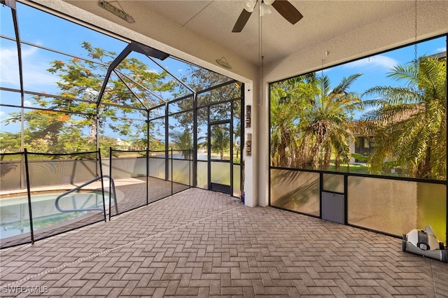 8169 Silver Birch Way, Lehigh Acres, FL 33971 - unfurnished sunroom with a ceiling fan