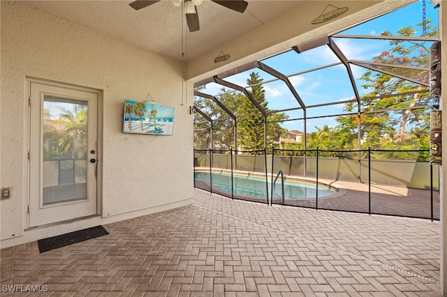 8169 Silver Birch Way, Lehigh Acres, FL 33971 - view of swimming pool with ceiling fan, a patio, and glass enclosure