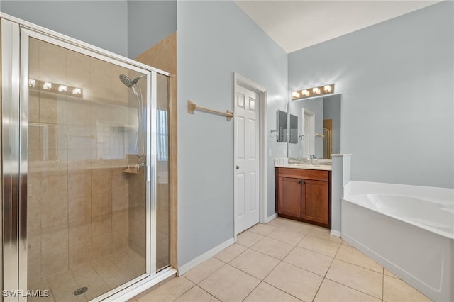 8169 Silver Birch Way, Lehigh Acres, FL 33971 - full bath with vanity, a shower stall, tile patterned flooring, and a garden tub