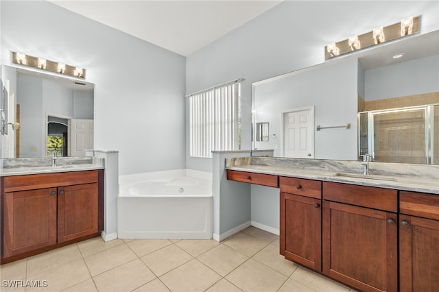 8169 Silver Birch Way, Lehigh Acres, FL 33971 - full bathroom with a stall shower, a bath, two vanities, and tile patterned floors