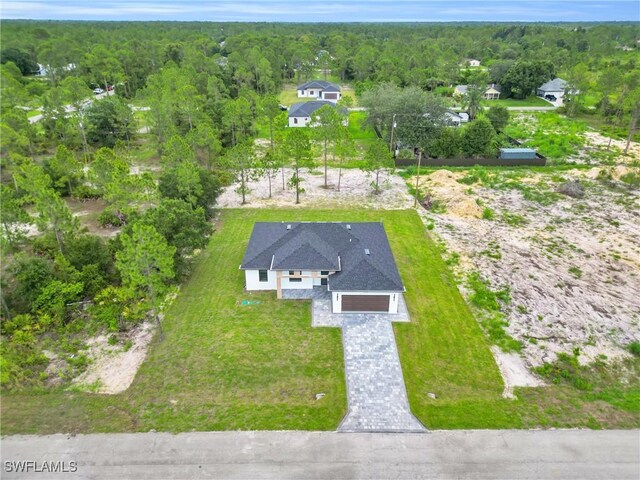 1018 Clayton Ave, Lehigh Acres, FL 33972 - aerial view of property and surrounding area featuring a heavily wooded area