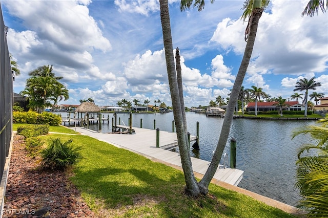 1167 SW 57th St, Cape Coral, FL 33914 - dock area featuring a water view and a yard