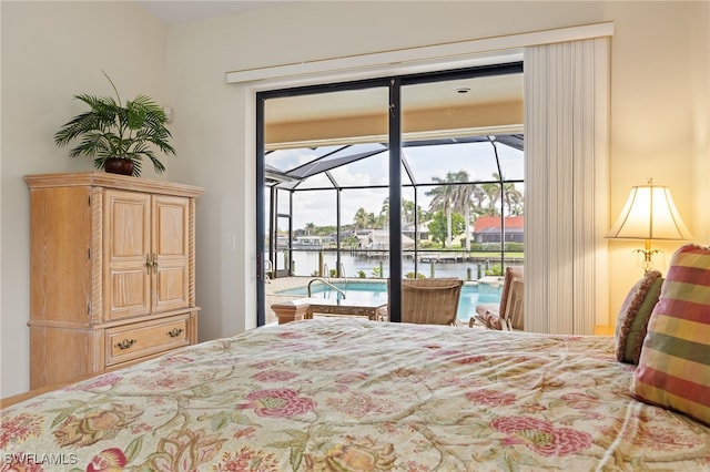1167 SW 57th St, Cape Coral, FL 33914 - bedroom featuring access to outside, a water view, and a sunroom