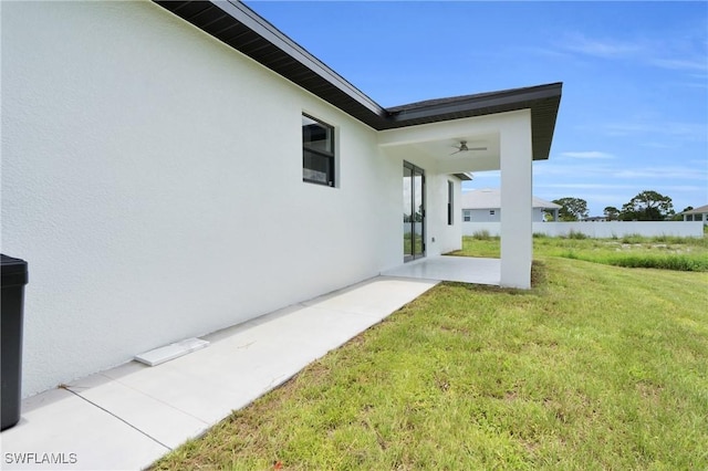 2505 40th St SW, Lehigh Acres, FL 33976 - view of green lawn featuring a patio area and ceiling fan