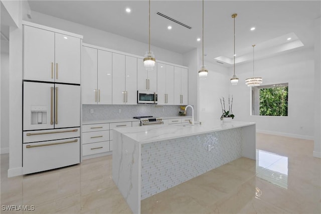 192 Herron Rd, North Fort Myers, FL 33903 - kitchen with stainless steel appliances, white cabinetry, recessed lighting, tasteful backsplash, and decorative light fixtures