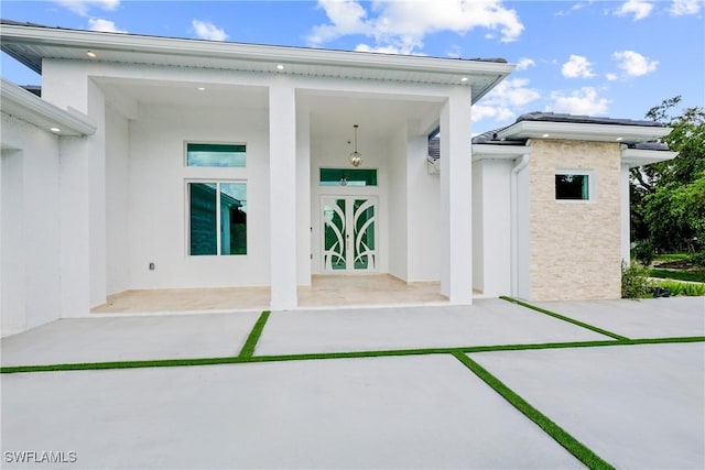 192 Herron Rd, North Fort Myers, FL 33903 - view of exterior entry with stucco siding