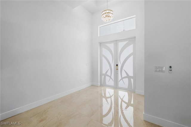 192 Herron Rd, North Fort Myers, FL 33903 - entrance foyer with a chandelier and a towering ceiling