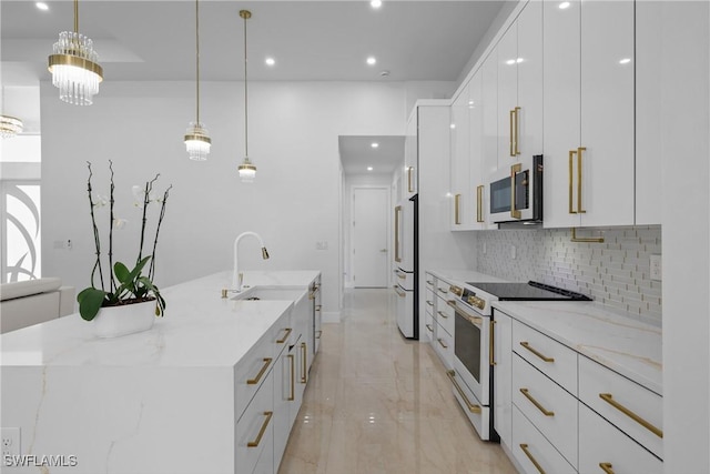 192 Herron Rd, North Fort Myers, FL 33903 - kitchen featuring white range with electric stovetop, modern cabinets, fridge, a large island with sink, and white cabinetry