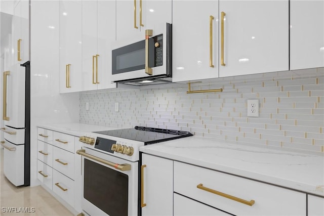 192 Herron Rd, North Fort Myers, FL 33903 - kitchen featuring white appliances, white cabinets, modern cabinets, backsplash, and light stone countertops