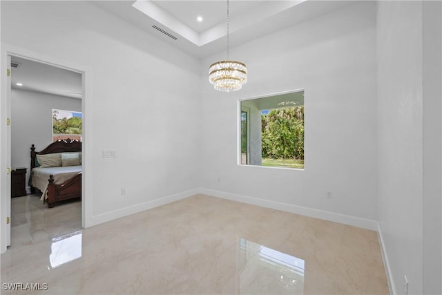 192 Herron Rd, North Fort Myers, FL 33903 - unfurnished room featuring a chandelier, recessed lighting, and a raised ceiling