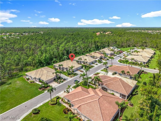 20698 Marathona Ct, North Fort Myers, FL 33917 - aerial view of residential area with a heavily wooded area