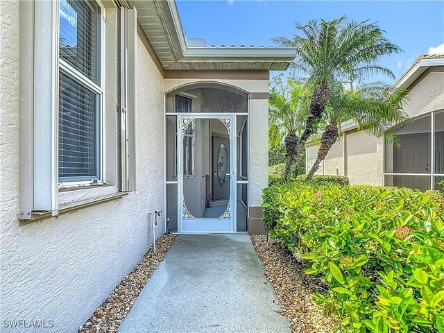 20698 Marathona Ct, North Fort Myers, FL 33917 - property entrance with stucco siding