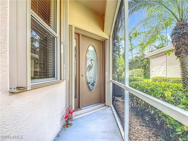 20698 Marathona Ct, North Fort Myers, FL 33917 - doorway to property with stucco siding