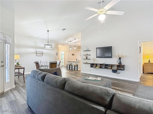 20698 Marathona Ct, North Fort Myers, FL 33917 - living room featuring wood finished floors, ceiling fan, and high vaulted ceiling