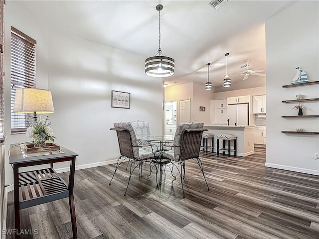20698 Marathona Ct, North Fort Myers, FL 33917 - dining room featuring dark wood-type flooring and a ceiling fan
