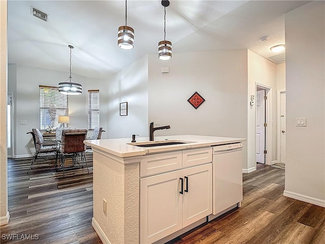20698 Marathona Ct, North Fort Myers, FL 33917 - kitchen with white dishwasher, dark wood-type flooring, pendant lighting, and an island with sink