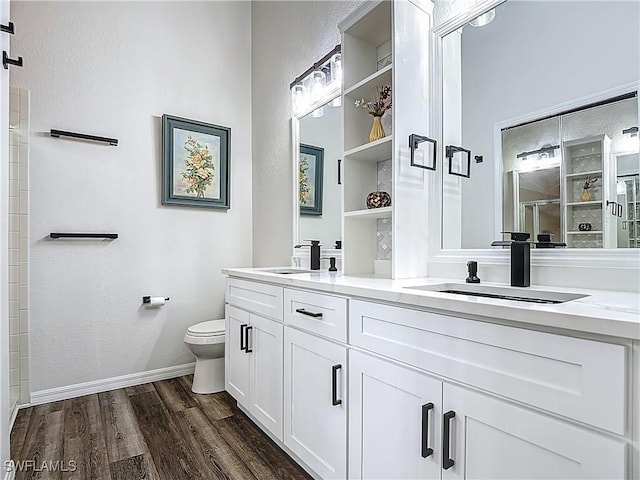 20698 Marathona Ct, North Fort Myers, FL 33917 - bathroom with double vanity, wood finished floors, a shower, and a textured wall