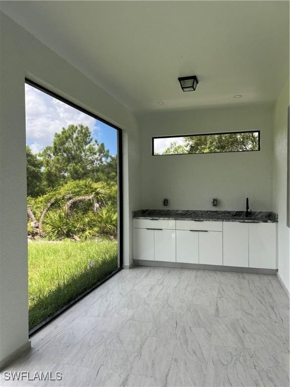 756 Chemstrand St E, Lehigh Acres, FL 33974 - unfurnished sunroom featuring a sink
