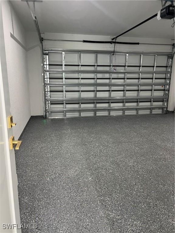 756 Chemstrand St E, Lehigh Acres, FL 33974 - garage with a garage door opener