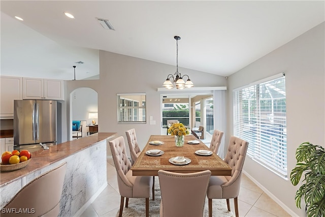 4200 SW 3rd Ave, Cape Coral, FL 33914 - dining area with arched walkways, lofted ceiling, light tile patterned floors, and a chandelier