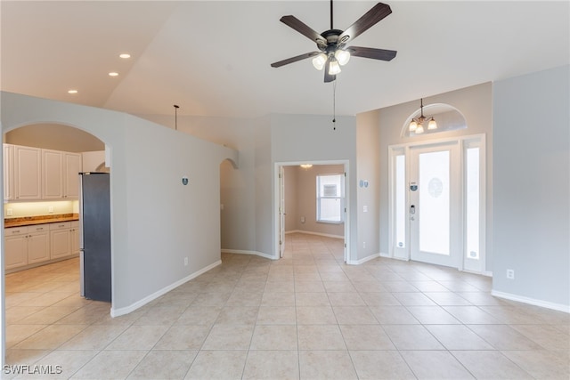 4200 SW 3rd Ave, Cape Coral, FL 33914 - unfurnished room with arched walkways, a ceiling fan, light tile patterned floors, recessed lighting, and vaulted ceiling