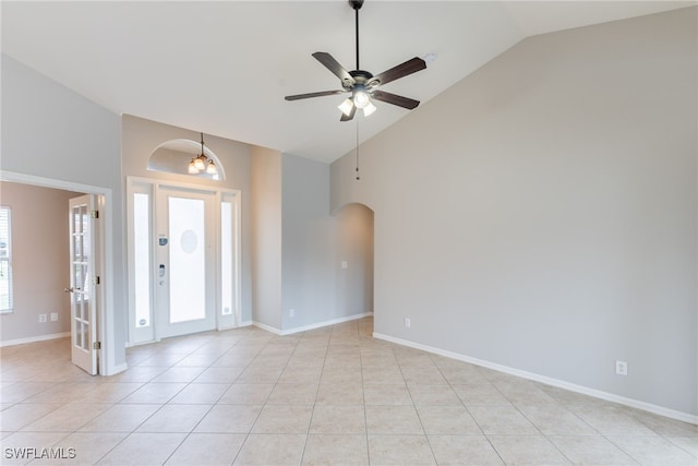 4200 SW 3rd Ave, Cape Coral, FL 33914 - unfurnished room with arched walkways, a ceiling fan, light tile patterned flooring, and high vaulted ceiling