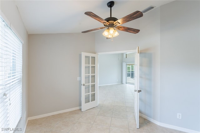 4200 SW 3rd Ave, Cape Coral, FL 33914 - spare room with french doors, light tile patterned flooring, ceiling fan, and lofted ceiling
