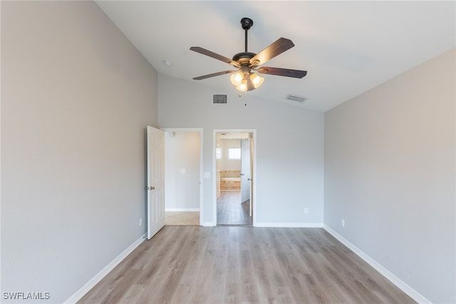 4200 SW 3rd Ave, Cape Coral, FL 33914 - unfurnished bedroom featuring lofted ceiling, light wood finished floors, ensuite bath, and ceiling fan