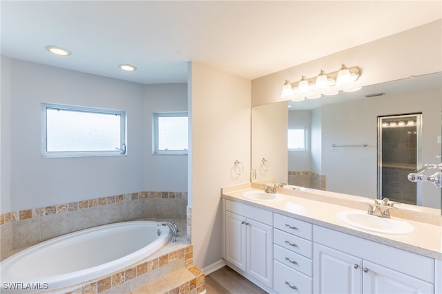 4200 SW 3rd Ave, Cape Coral, FL 33914 - full bath with double vanity, a bath, and plenty of natural light