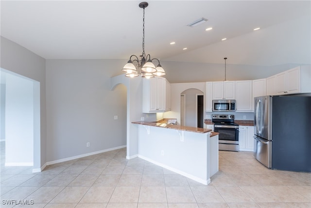 4200 SW 3rd Ave, Cape Coral, FL 33914 - kitchen featuring stainless steel appliances, arched walkways, a peninsula, white cabinets, and lofted ceiling