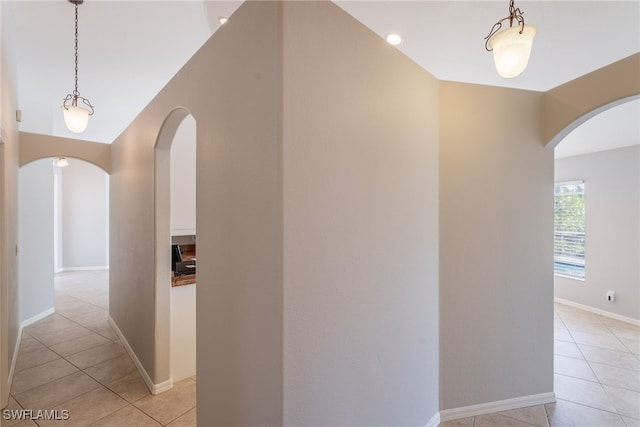 4200 SW 3rd Ave, Cape Coral, FL 33914 - corridor with arched walkways and light tile patterned flooring