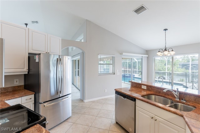 4200 SW 3rd Ave, Cape Coral, FL 33914 - kitchen with appliances with stainless steel finishes, arched walkways, plenty of natural light, hanging light fixtures, and high vaulted ceiling
