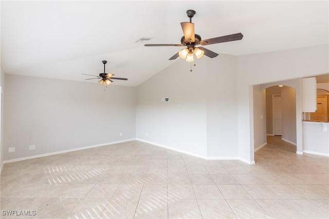 4200 SW 3rd Ave, Cape Coral, FL 33914 - empty room with a ceiling fan, arched walkways, light tile patterned floors, and lofted ceiling