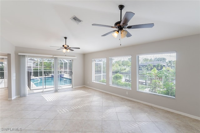 4200 SW 3rd Ave, Cape Coral, FL 33914 - empty room with a ceiling fan, light tile patterned floors, and a sunroom