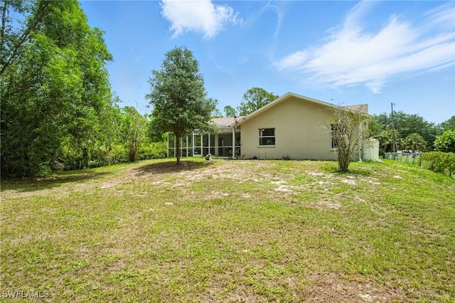 2711 4th St NW, Naples, FL 34120 - view of green lawn with a sunroom