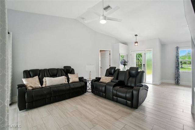 2711 4th St NW, Naples, FL 34120 - living area with vaulted ceiling, a ceiling fan, and light wood-style floors