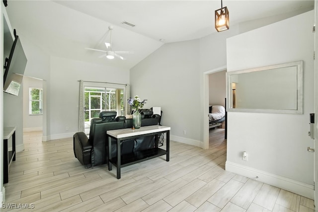 2711 4th St NW, Naples, FL 34120 - living room with ceiling fan, high vaulted ceiling, and light wood finished floors