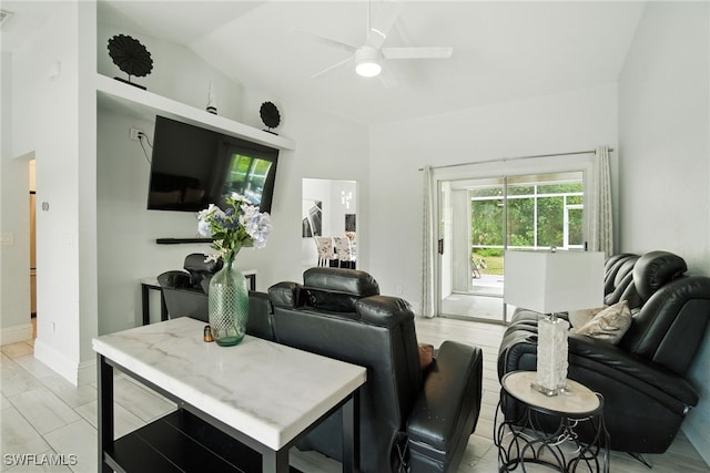 2711 4th St NW, Naples, FL 34120 - living room with ceiling fan and vaulted ceiling